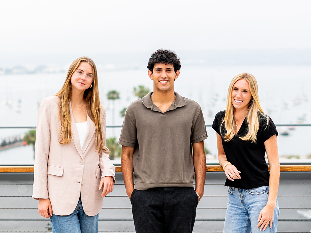 Colrich Interns - 3 interns standing on outdoor deck